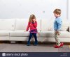 young-boy-and-girl-walking-in-high-heels-BM0HX0.jpg
