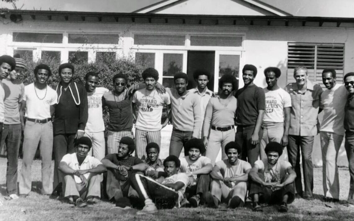 1971 Howard soccer  team -- Back row (left to right): Ernest Skinner, Ian Bain, Steve Waldron, Michael Billy-Jones, Olusegun Onadeko, Charlie Pyne, Keith Aqui, Samuel Tetteh, Zewdu Haplemariam, Sandy Daly, Eddie Holder, Amdemichael Selassie, Jamaican politician Michael Manley, Lincoln Phillips, Milton Miles. Front row (left to right): Desmond Alfred, Tony Martin, Mori Diane, Ricky Yallery Arthur, Stan Smith, Alvin Henderson, Donnie Simmons.