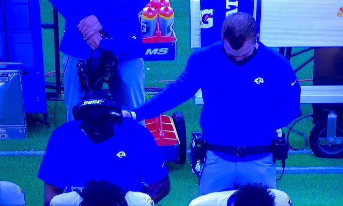 Former HBCU star, L.A. Rams assistant coach Tory Woodbury kneels during the anthem