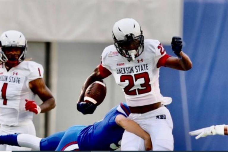 Jackson State two-way player Isaiah Bolden gets a look from Bill Belichick